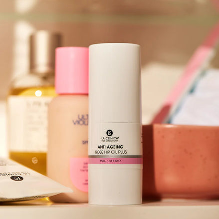 Anti Ageing Rose Hip Oil Plus on a shelf with other items in the background