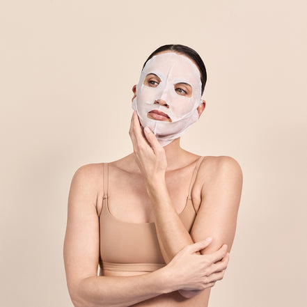 Woman wearing Dp Hyla Active 3D Sculptured Mask against a beige background