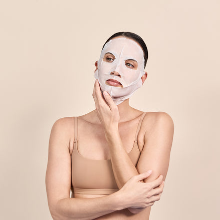 Woman wearing Dp Hyla Active 3D Sculptured Mask against a beige background