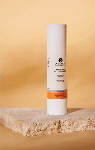 Essentials Re-Activation Nourishing Facial Oil on a beige background