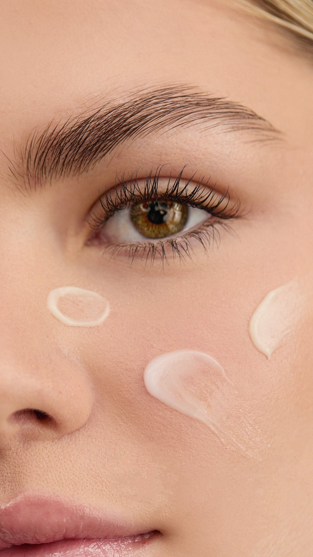 Close-up of a woman's face with Blemish Control Cream on her skin