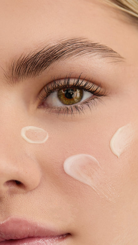 Close-up of a woman's face with Blemish Control Cream on her skin