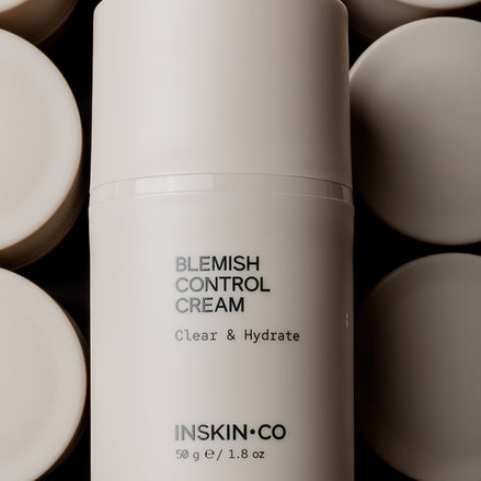 Blemish Control Cream container with 'INSKIN CO' branding on a dark background