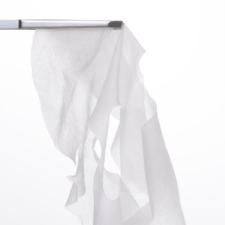 Plump & Hydrate Daily Sheet Mask held in tongs on a white background