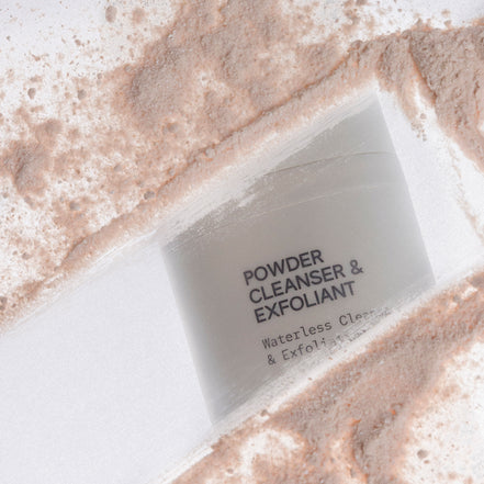 INSKIN.CO Powder cleanser and exfoliant packaging on a textured surface