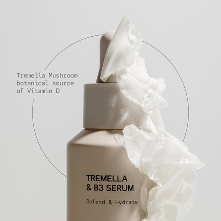 Tremella & B3 Serum bottle with white fabric on a light gray background