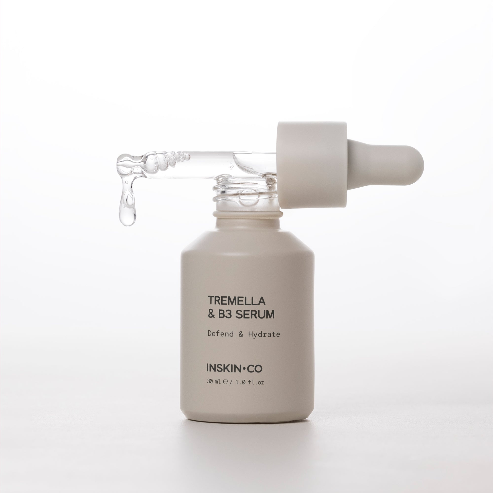 Skincare serum bottle with dropper labeled 'Tremella & B3 Serum' by 'INSKIN&CO' on a white background.