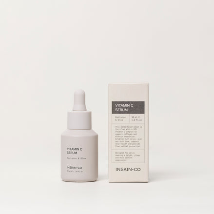 Vitamin C serum bottle and packaging on a white background