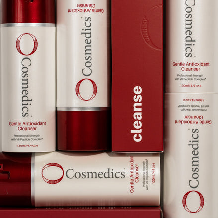 OCosmedics Gentle Antioxidant Cleanser bottles and packaging on a red background