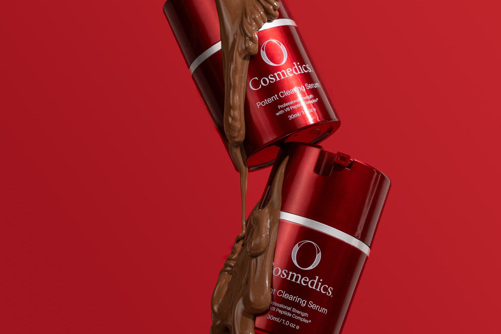 'O' Potent Clearing Serum bottles with chocolate being poured over them on a red background