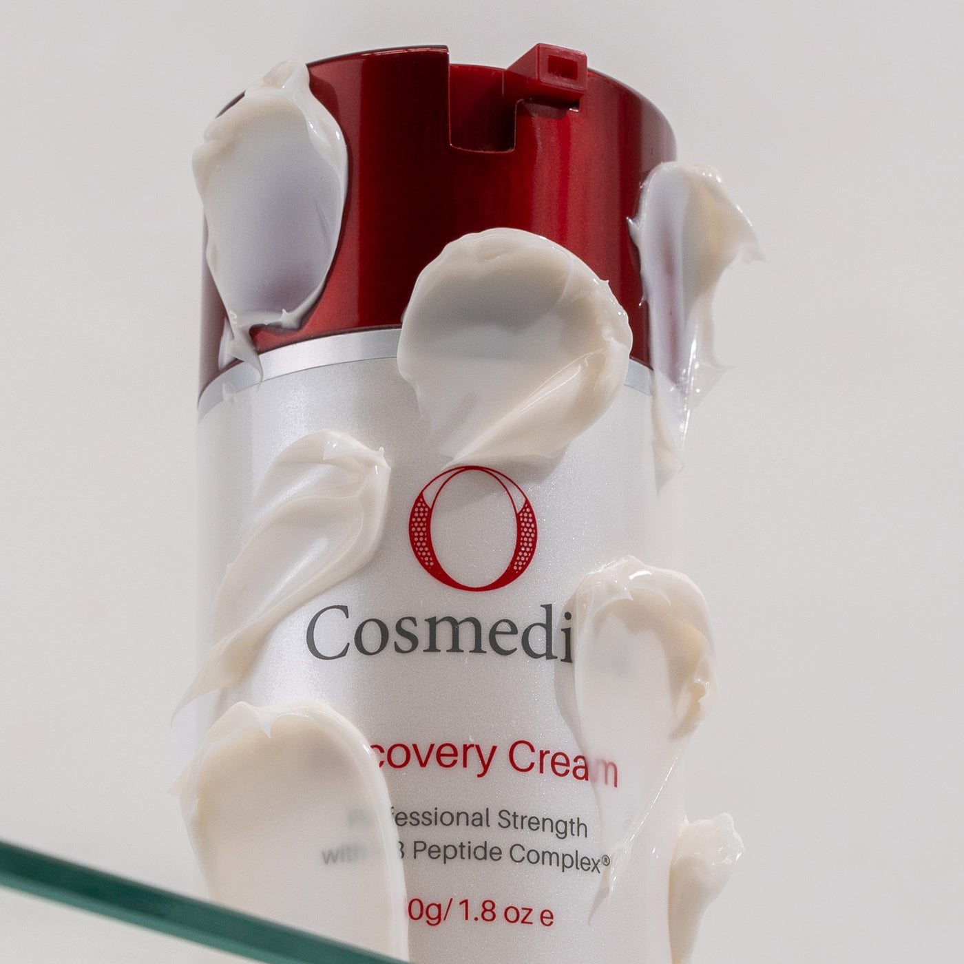 O Recovery Cream with cream blots