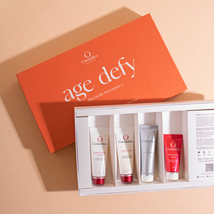 OCosmedics age defy skincare Kit 2 product set with an orange box on a beige background
