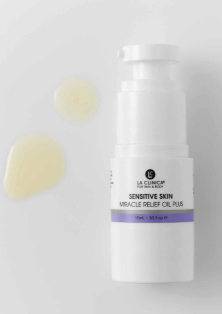 Skincare bottle labeled 'Sensitive Skin Miracle Relief Oil Plus' on a light gray background