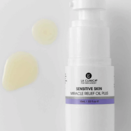 Skincare bottle labeled 'Sensitive Skin Miracle Relief Oil Plus' on a light gray background